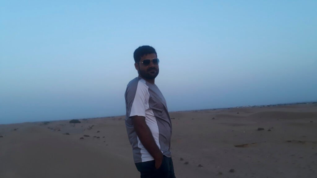 Man traveling and finding peace of mind under a clear blue sky